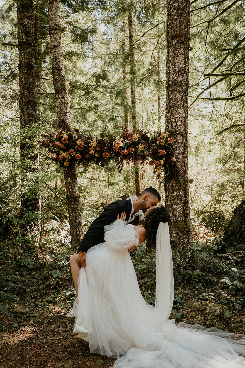 the bride and groom kissing at Woodlands house venue's ceremony area. 