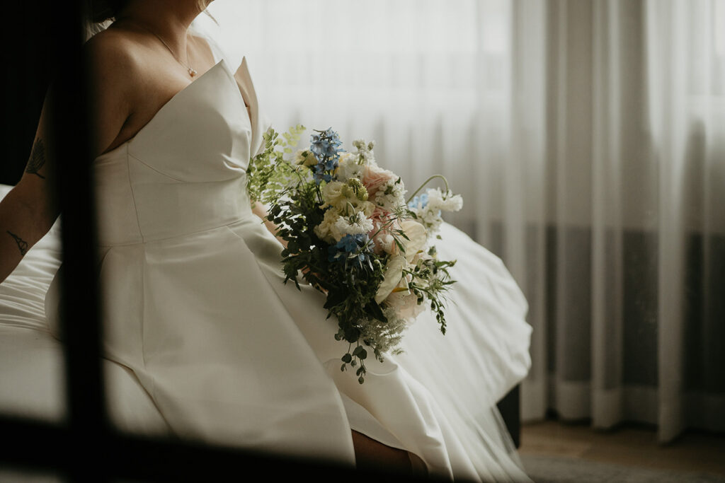 the bride posing with her bouquet. 