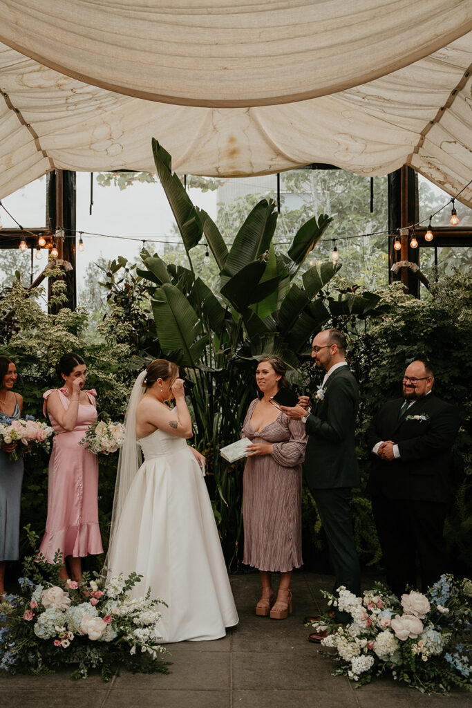 the bride tearing up during her Blockhouse PDX wedding ceremony. 