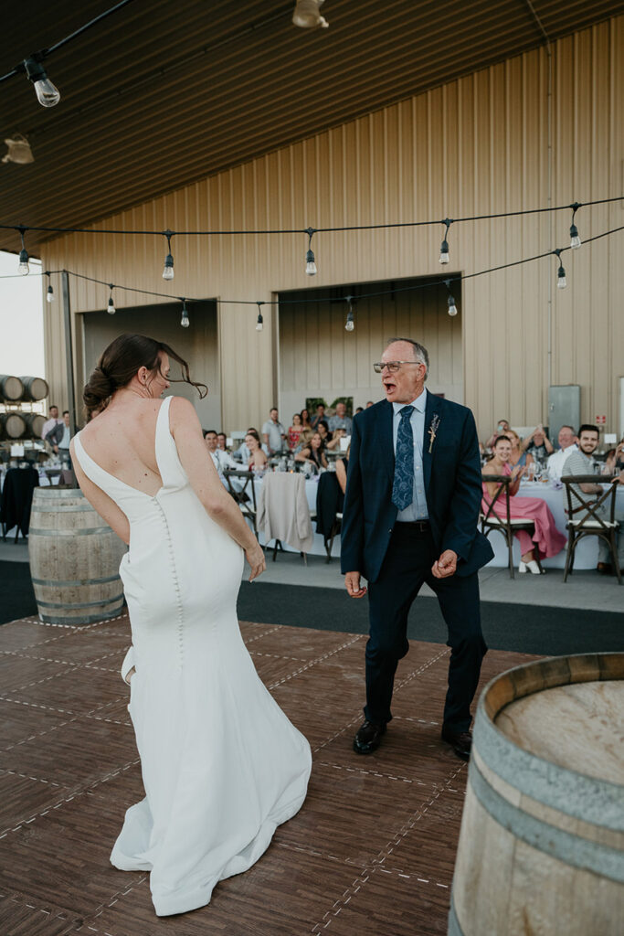 the bride and her father dancing. 