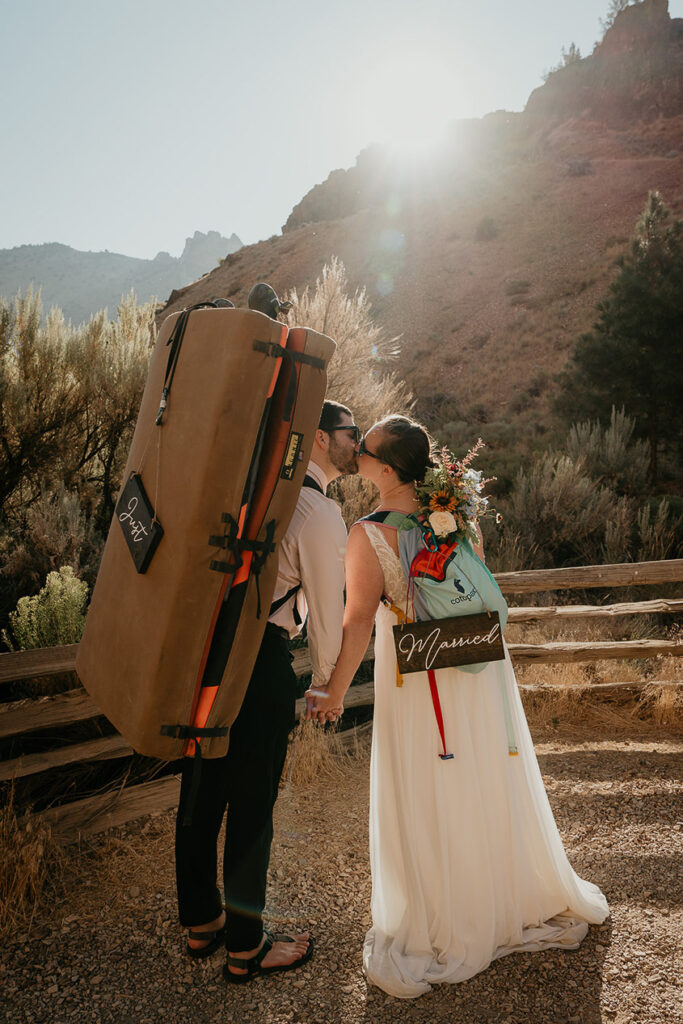 A rock-climbing couple as they elope in Smith Rock. 