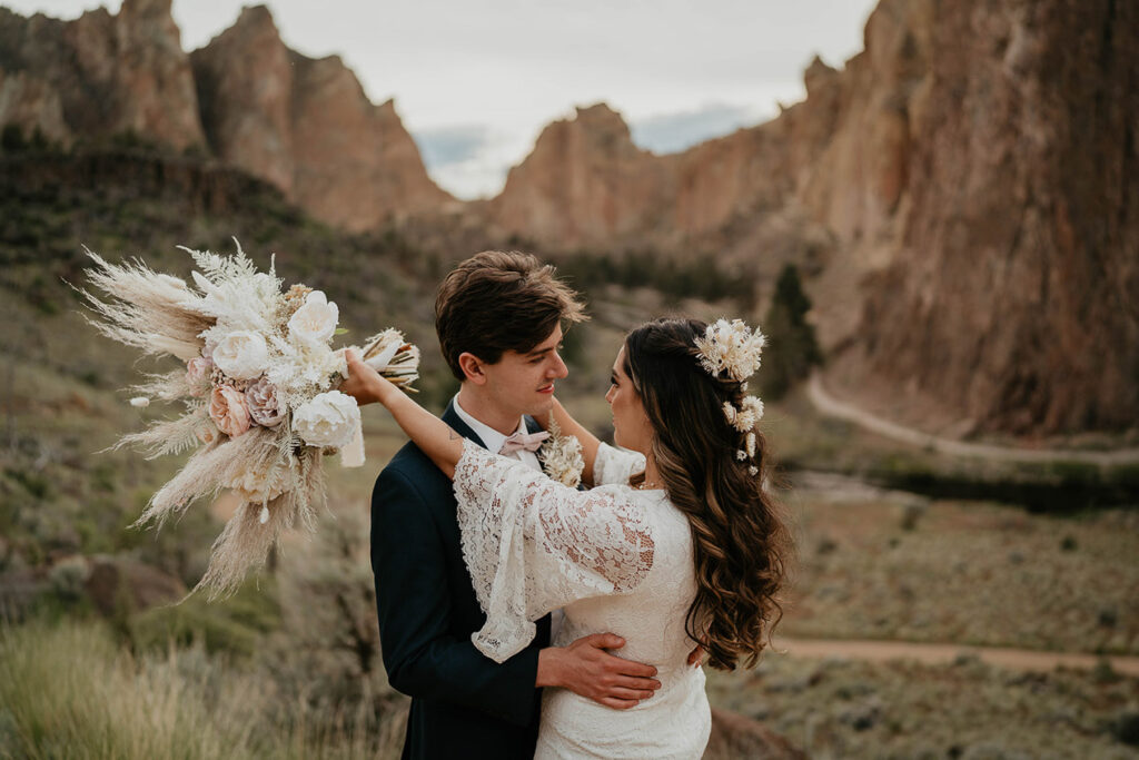 a couple hugging as they elope in Smith Rock.