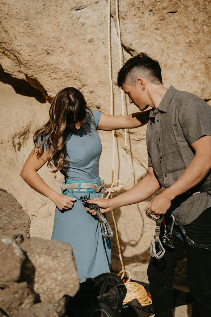 A couple getting ready to rock climb in Smith Rock. 