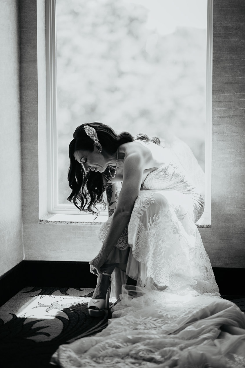 the bride putting on her heals. 