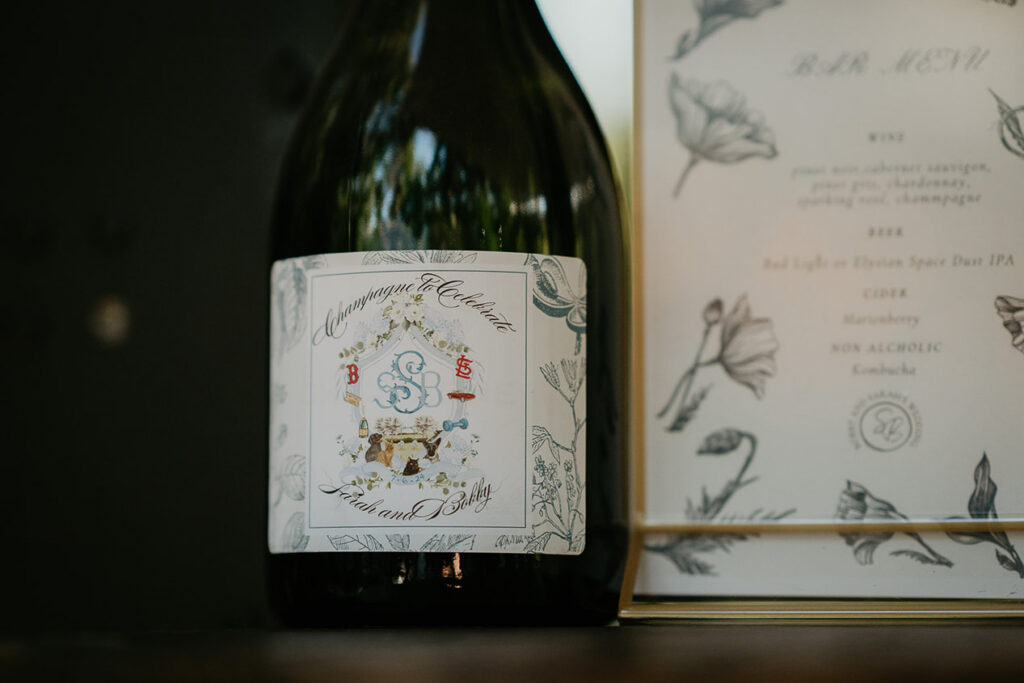 the newlywed's wedding crest on a wine bottle, and their dinner menu. 