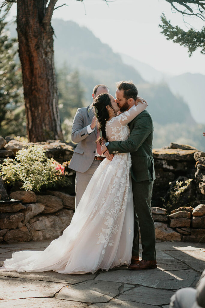 A couple kissing after getting marries at The Griffin House. 