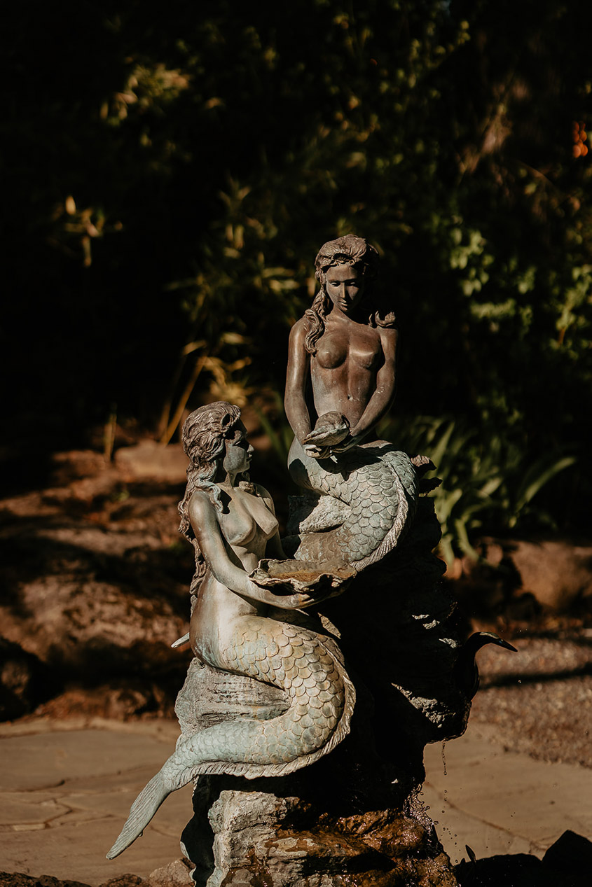 A statue of two mermaids. 