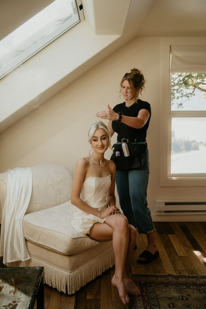 a bride to be getting her hair styled. 