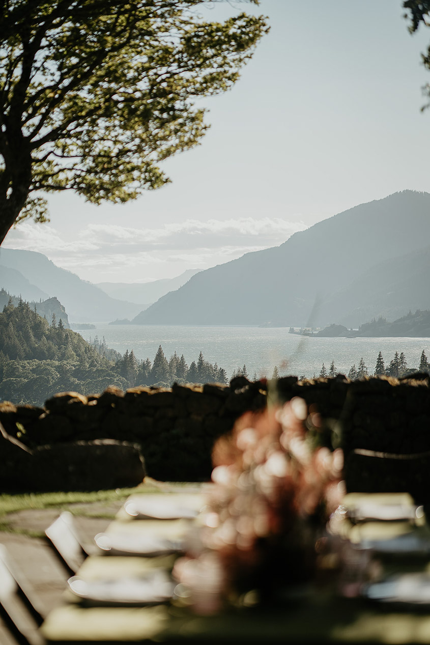 blurred table settings and the Columbia River Gorge. 