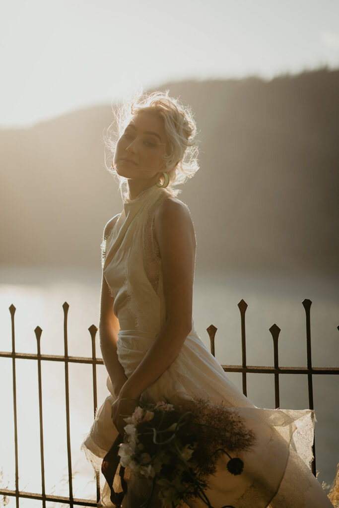 the bride posing at sunset with the Columbia River Gorge in the background. 