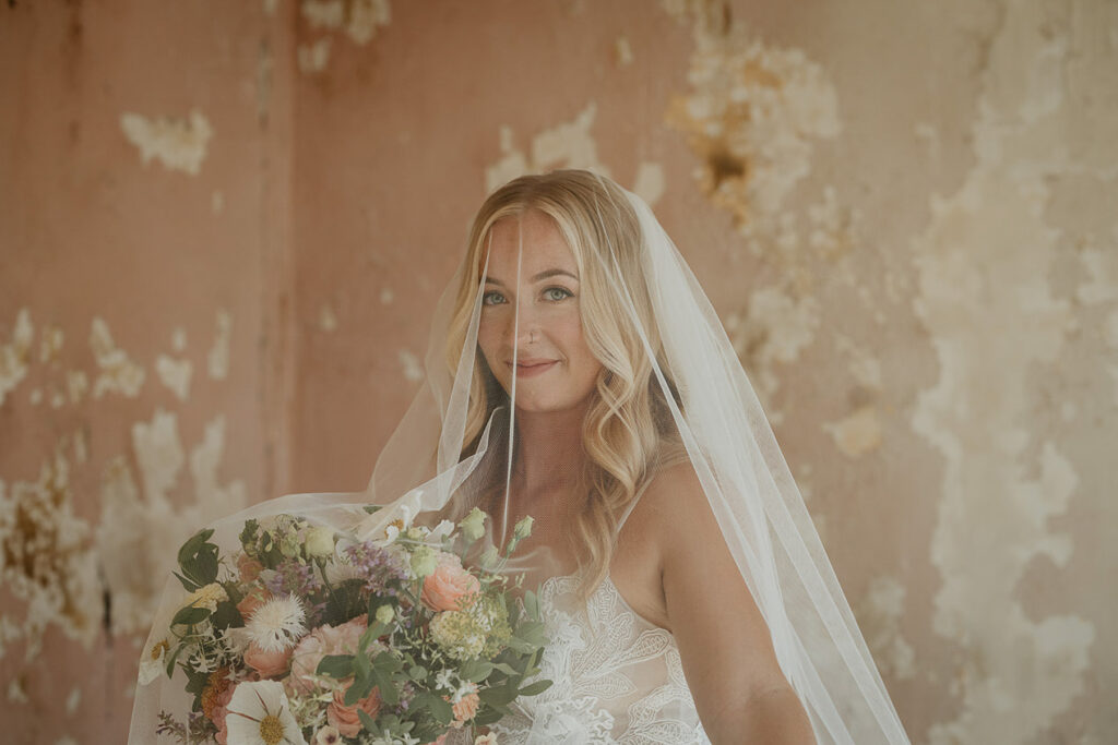 The bride holding a bouquet of flowers. 